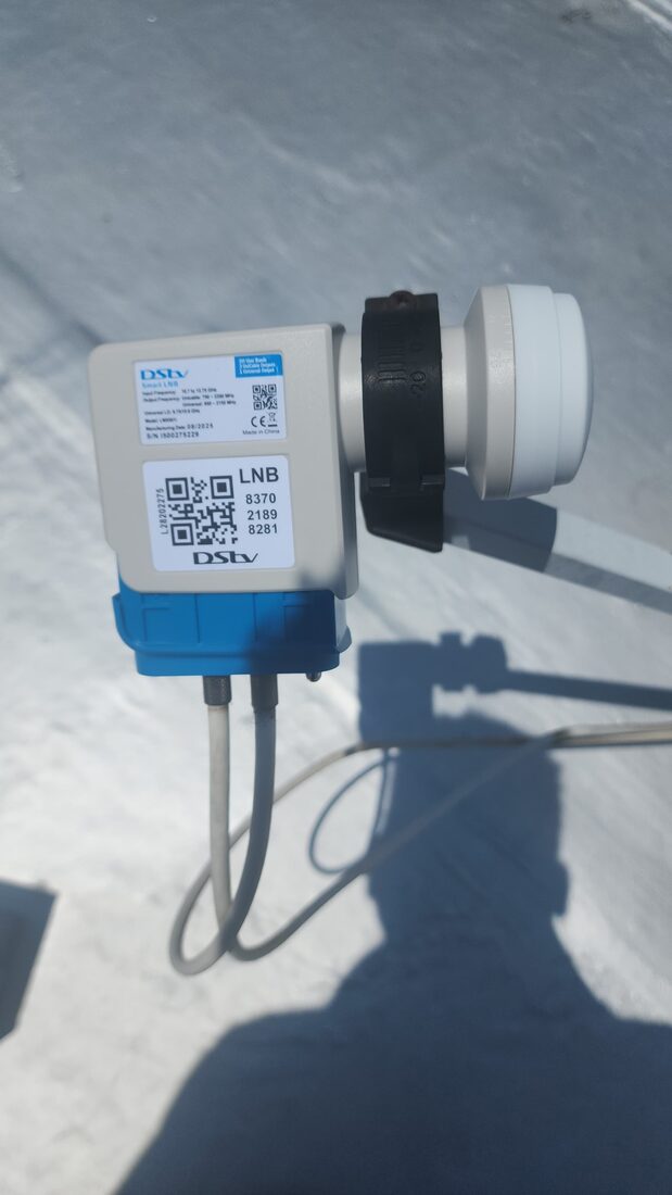 DStv Smart LNB installed on a satellite dish during a signal alignment job